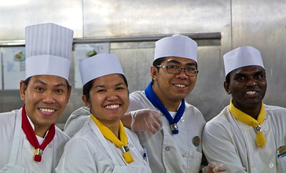 Chefs posing and smiling together